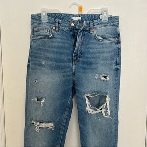Distressed blue jeans